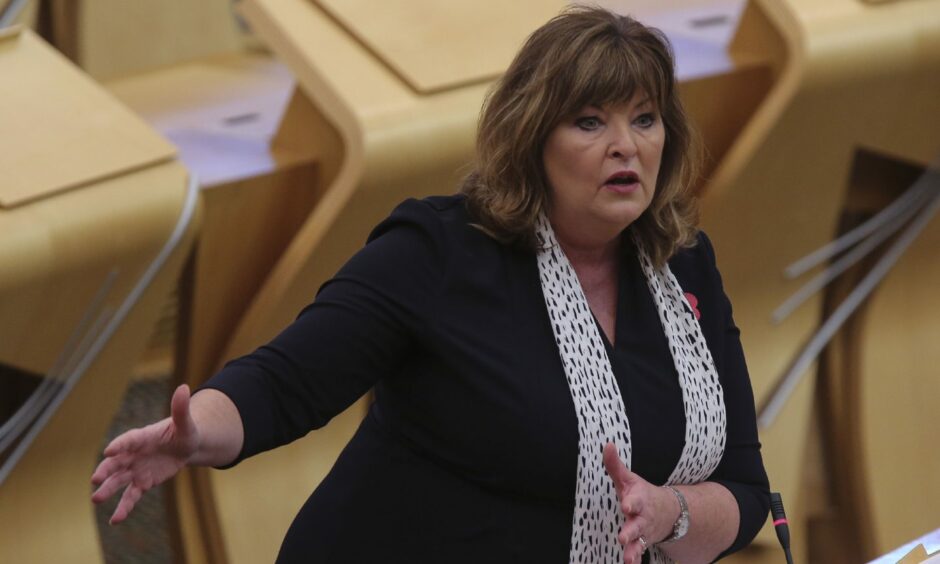 Fiona Hyslop standing up in the Scottish Parliament.