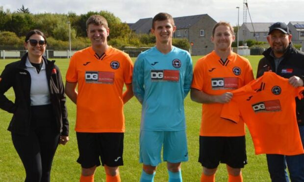 Fraserburgh United JFC's new strips are sponsored by Dennis Gordon Electrical. Image supplied by Fraserburgh United JFC.