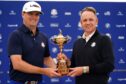 Team Europe captain Luke Donald (right) alongside US captain Zach Johnson with the Ryder Cup Trophy. Image: PA