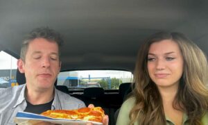 Andy and Karla preparing to tuck into one of the baked goods from the Westhill drive-thru.