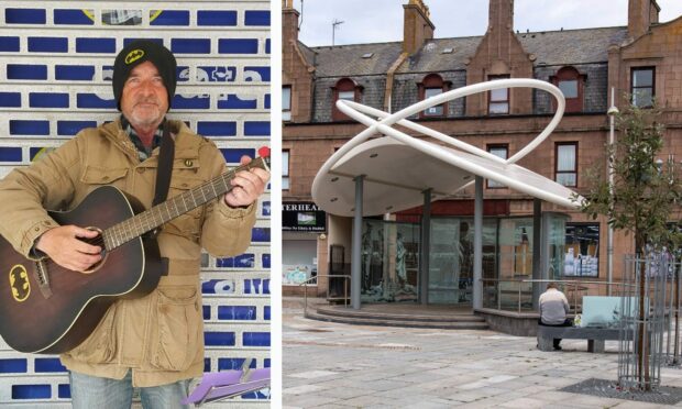 Peterhead busker Craig Watson with the new bandstand at Drummers Corner. Image: Kirstie Topp/DC Thomson