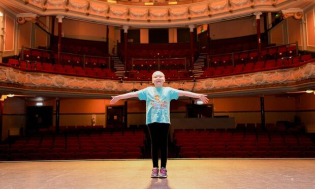 Izzy Noble on stage at the Tivoli Theatre.