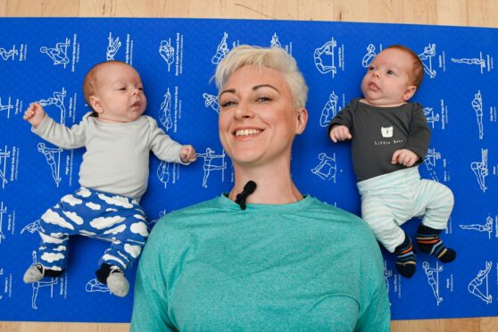 KDB Energy's Katie Duncan-Bruce pictured with one of her client's twins (left) Dylan and Arran at one of her classes at Portessie Town Hall. Image: Jason Hedges/DC Thomson