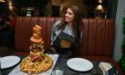 P&J Food & Drink reporter, Karla Sinclair, with the Elgin Humble burger challenge in front of her