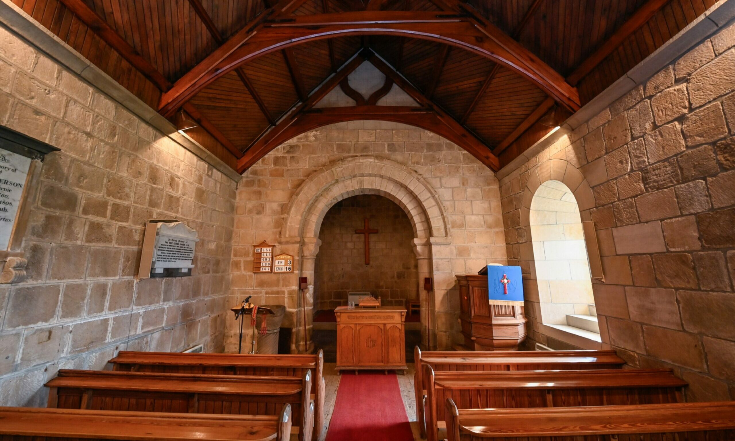 Looking from rear of Birnie Kirk to alter under stone arch.