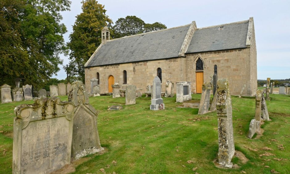 Looking through graveyard to Birnie Kirk.