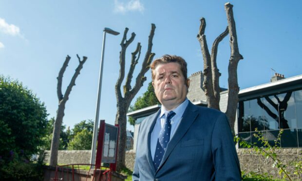 Colin Mackay has slammed the "butchery" of the trees on Spademill Road. Image: Kenny Elrick/DC Thomson