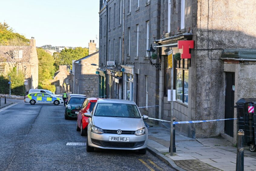 Large police presence on Spital in Aberdeen after a man was injured. 