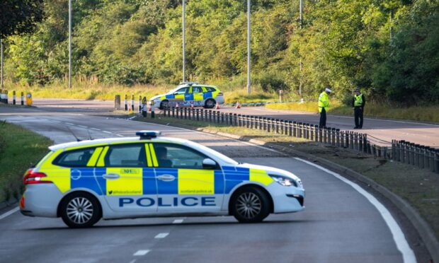 Police at the scene on the A92 road near Aberdeen