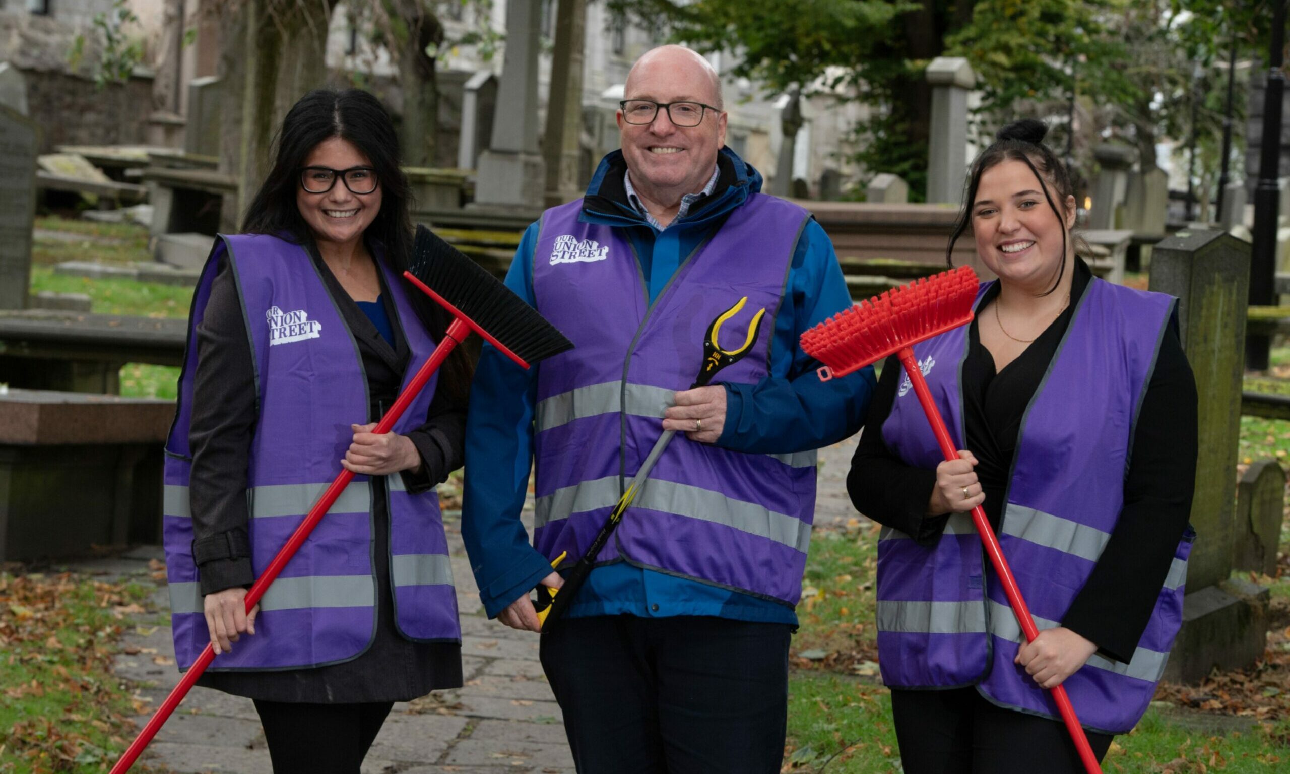 Our Union Street leader Bob Keiller, Janine Gatchalian and Honey Keenan during a clean up at St Nicholas Cemetery on Union Street. 