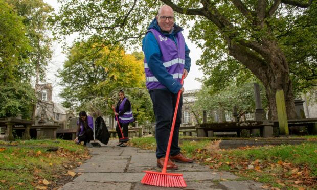 Our Union Street leader Bob Keiller getting stuck in by helping to sweep up St Nicholas Kirkyard.