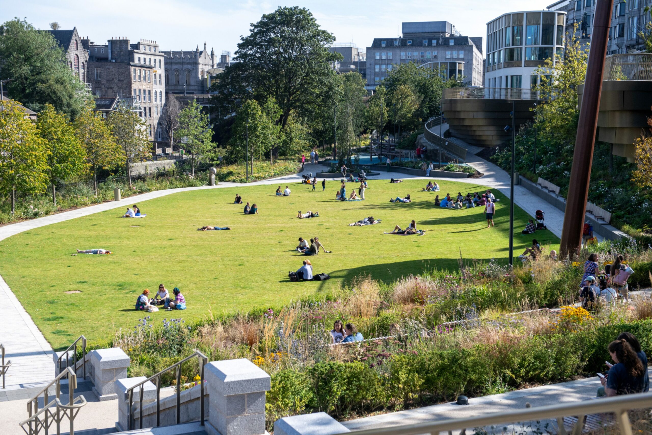Locals enjoy the sunshine at Aberdeen's Union Terrace Gardens during a heatwave.