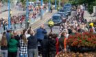Mourners watch as the Queen's cortege travels over the King George VI Bridge, Aberdeen. Image: Kath Flannery/DC Thomson.