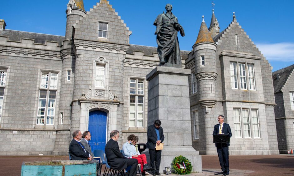 Descendants of the first boy who laid a wreath at the Lord Byron statue in 1923 gathered around the statue during the ceremony.