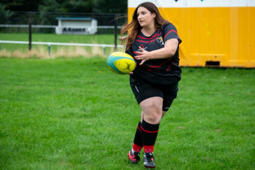 Coral-Ann Birnie playing at Aberdeenshire Quines women's rugby club.
