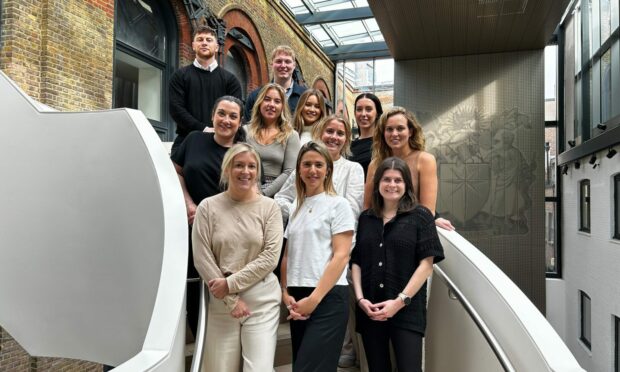 Chief commercial officer Laura Iley, front centre, and other members of the growing Scottish team at Aspectus.