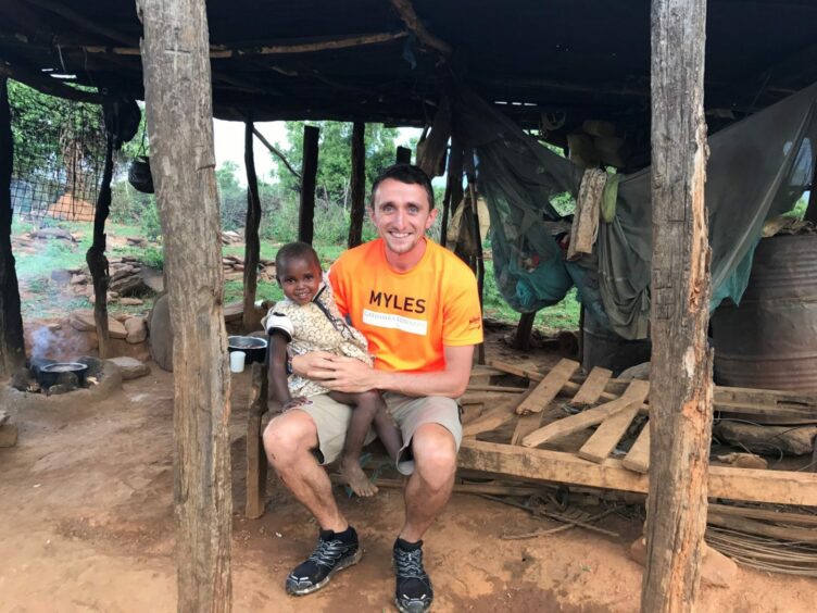 Myles Edwards with Faith Jemutai in Kenya. Pic: Gathimba Edwards Foundation.