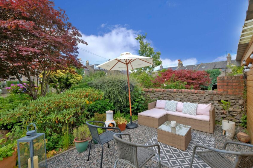 The garden and sitting area in the Aberdeen flat for sale.