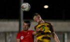Nairn County player-manager Steven Mackay, left, challenges Ethan Cairns of Forres Mechanics