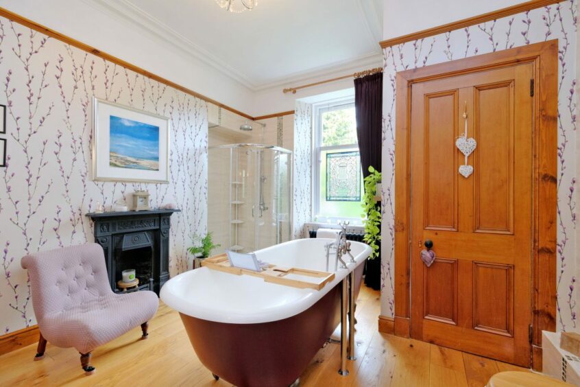 Large bathroom with stand-alone tub in the property for sale in Aberdeen.