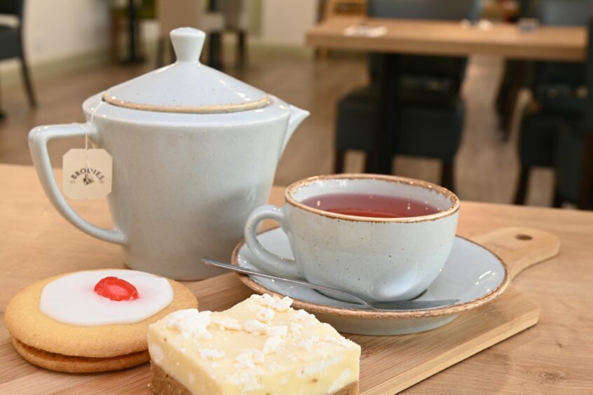 An Empire biscuit, lemon meringue cake slice, and a pot of red berry tea from Simpsons in Inverness.