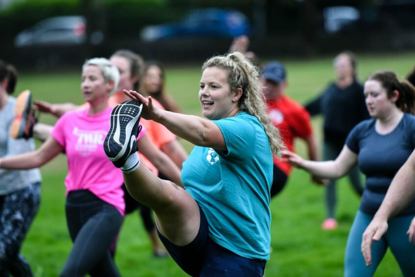 Alice leading a Rebel PT fitness bootcamp in an Aberdeen park.