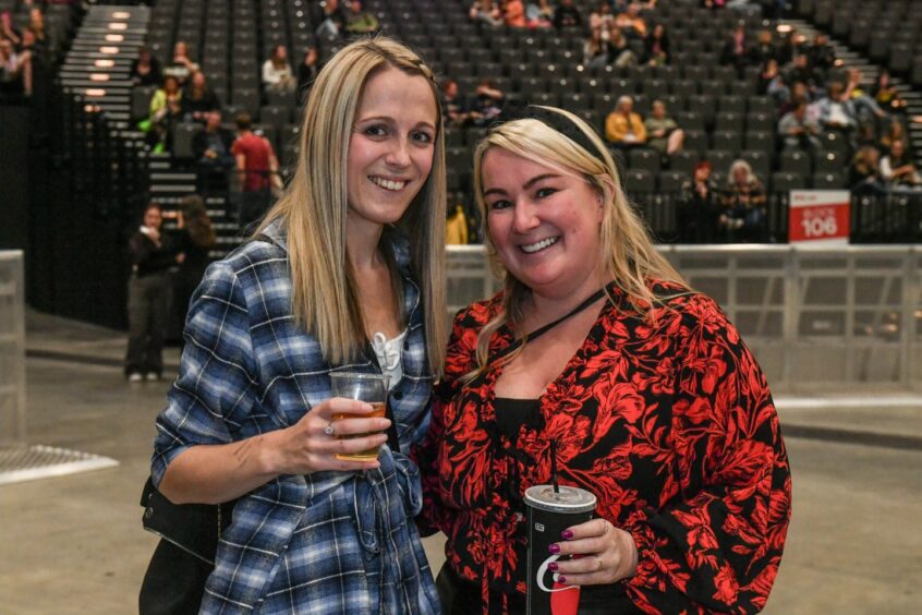 Two women with drinks in Aberdeen for Busted's UK tour
