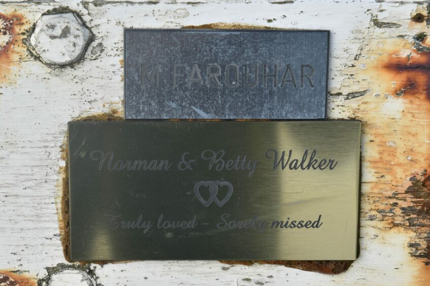 Family ties captured in the image of two memorial plaques in Torry. 