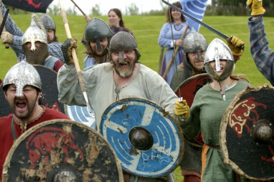 Members of 'Glasgow Vikings' reenact a scene from a 9th century battle at Archaeolink prehistory park's Invasion Event back in 2006