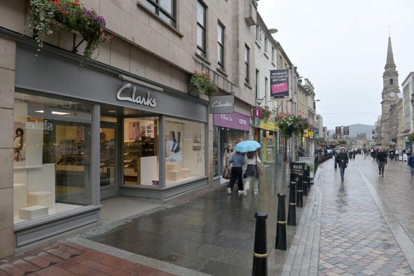 Exterior of Clarks store on Inverness High Street, with windows cleared as the store prepares to close.