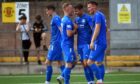 Peterhead's Kieran Shanks (second from right) celebrates with his teammates after his goal. Image: Duncan Brown.