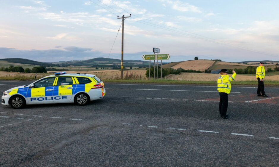 Police on the scene of a three-car-crash near Huntly.