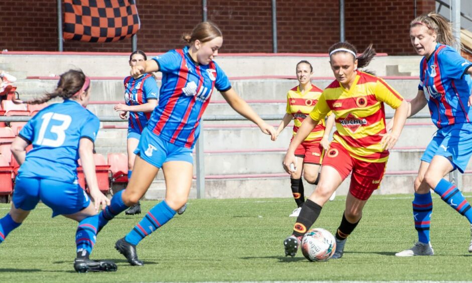 Caley Thistle Women players battle for the ball in a SWF Championship match against Rossvale.