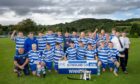 The victorious Newtonmore team, with HIS sponsor Garry Mackintosh (second right) after winning the 100th Sutherland Cup final. Image: Neil Paterson.