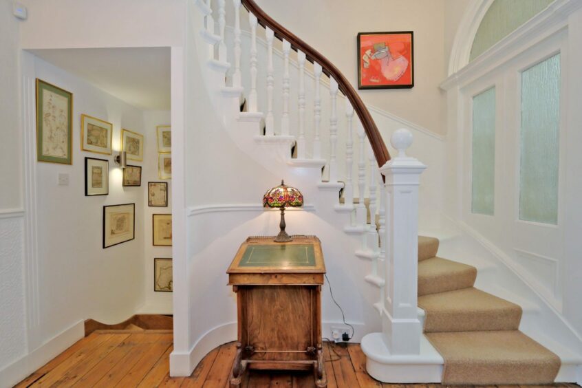 A curved staircase leading to the upper floor of the house. 