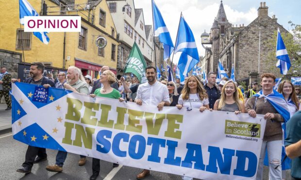 First Minister Humza Yousaf (centre) takes part in September's Believe in Scotland march from Edinburgh Castle (Image: Jane Barlow/PA Wire)