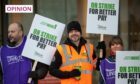 Unison members during last year's strike action outside RGU. The union's latest strike has led to school closures affecting pupils and parents across the north and north-east this week. Image: Kami Thomson/DC Thomson