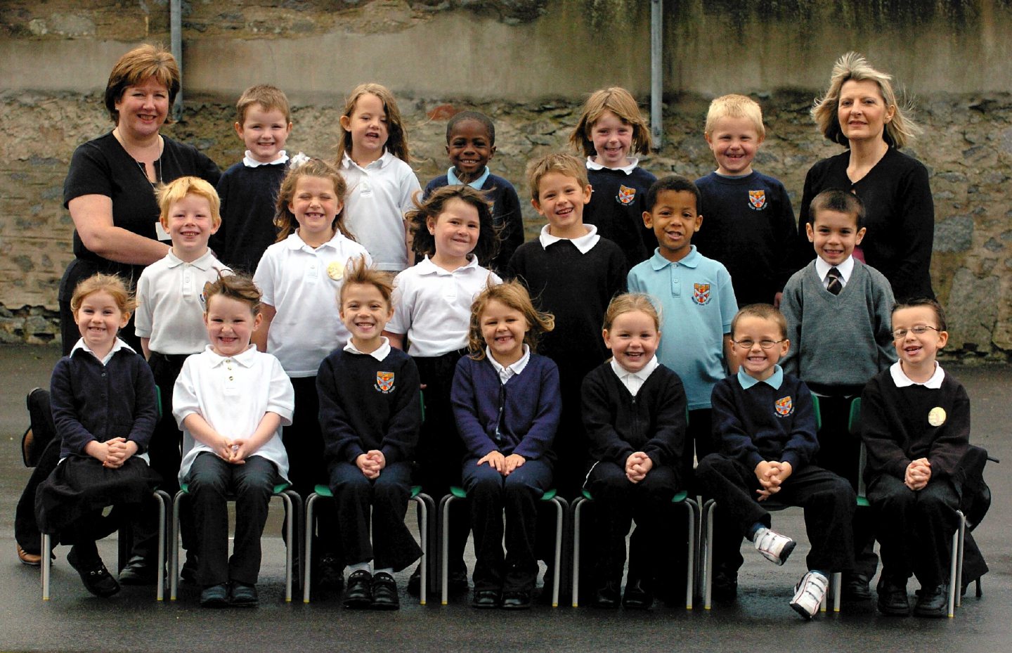  Classroom assistant Barbara Massie and teacher Edwina Gray with new P1s in 2004.