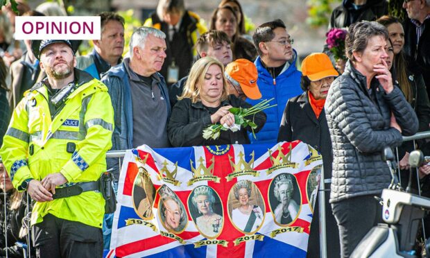 Mourners line the route of the Queen's cortege in Aberdeenshire