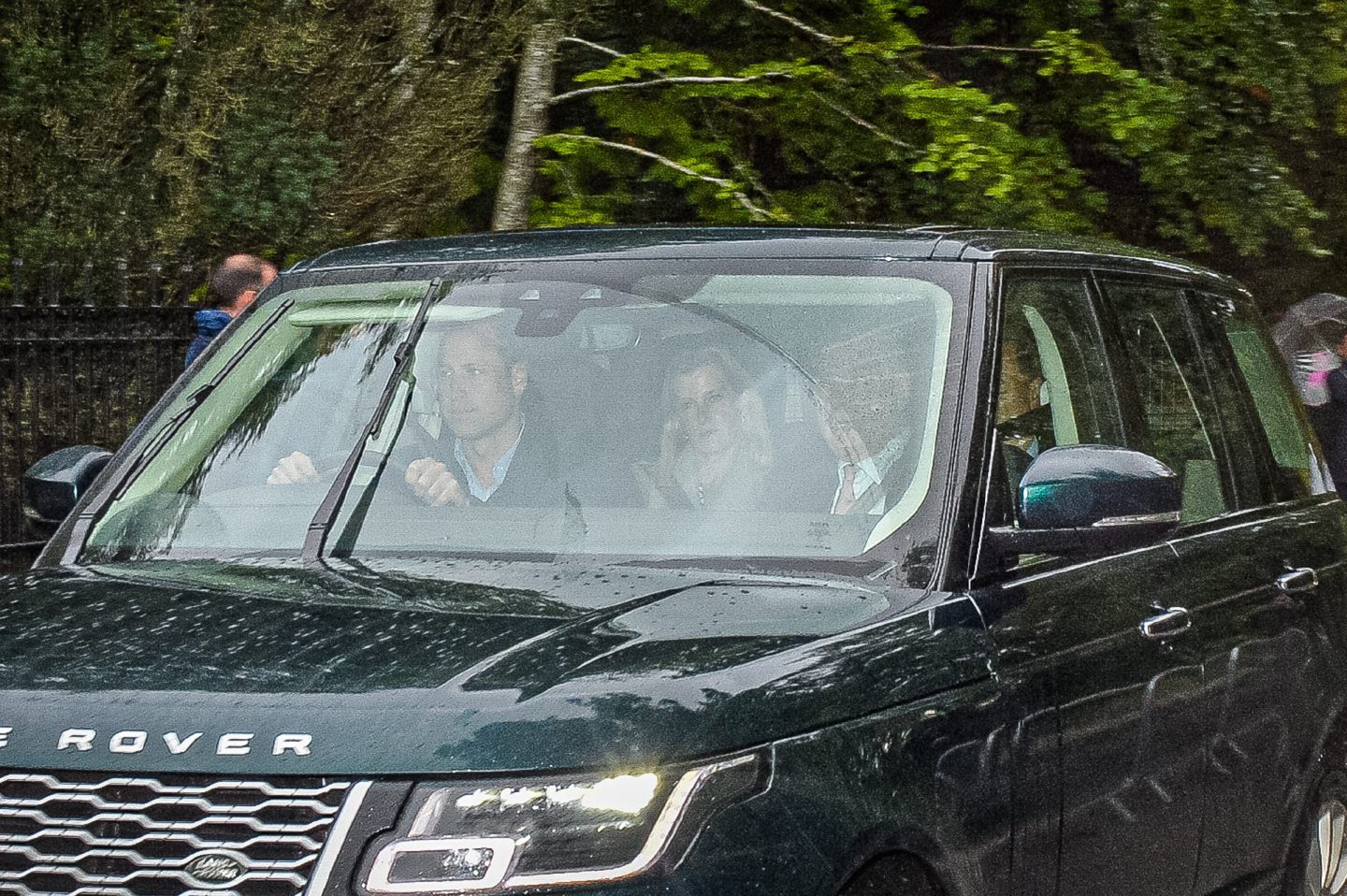 Royals barely visible through tinted windscreen inside Range Rover arriving at Balmoral