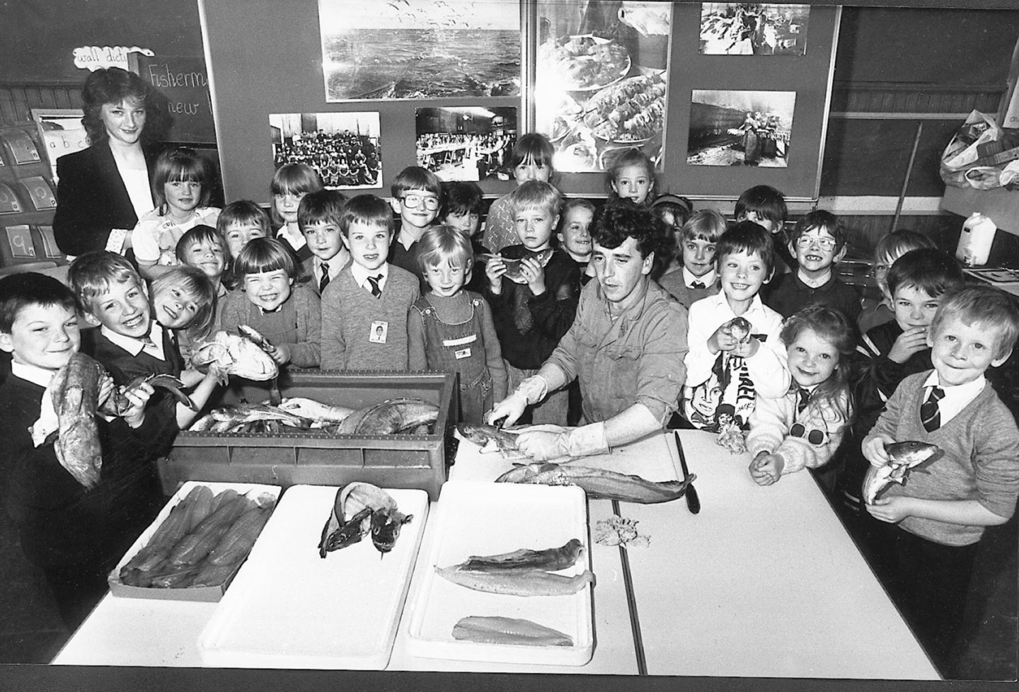 John Taylor of A. Massie and Sons gives students a talk on the fishing industry in 1990.
