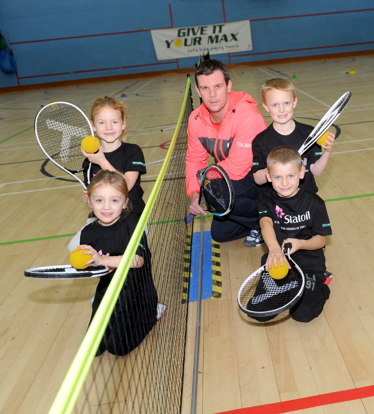 Four pupils at a specialist tennis coaching session with coach Leon Smith in 2014.