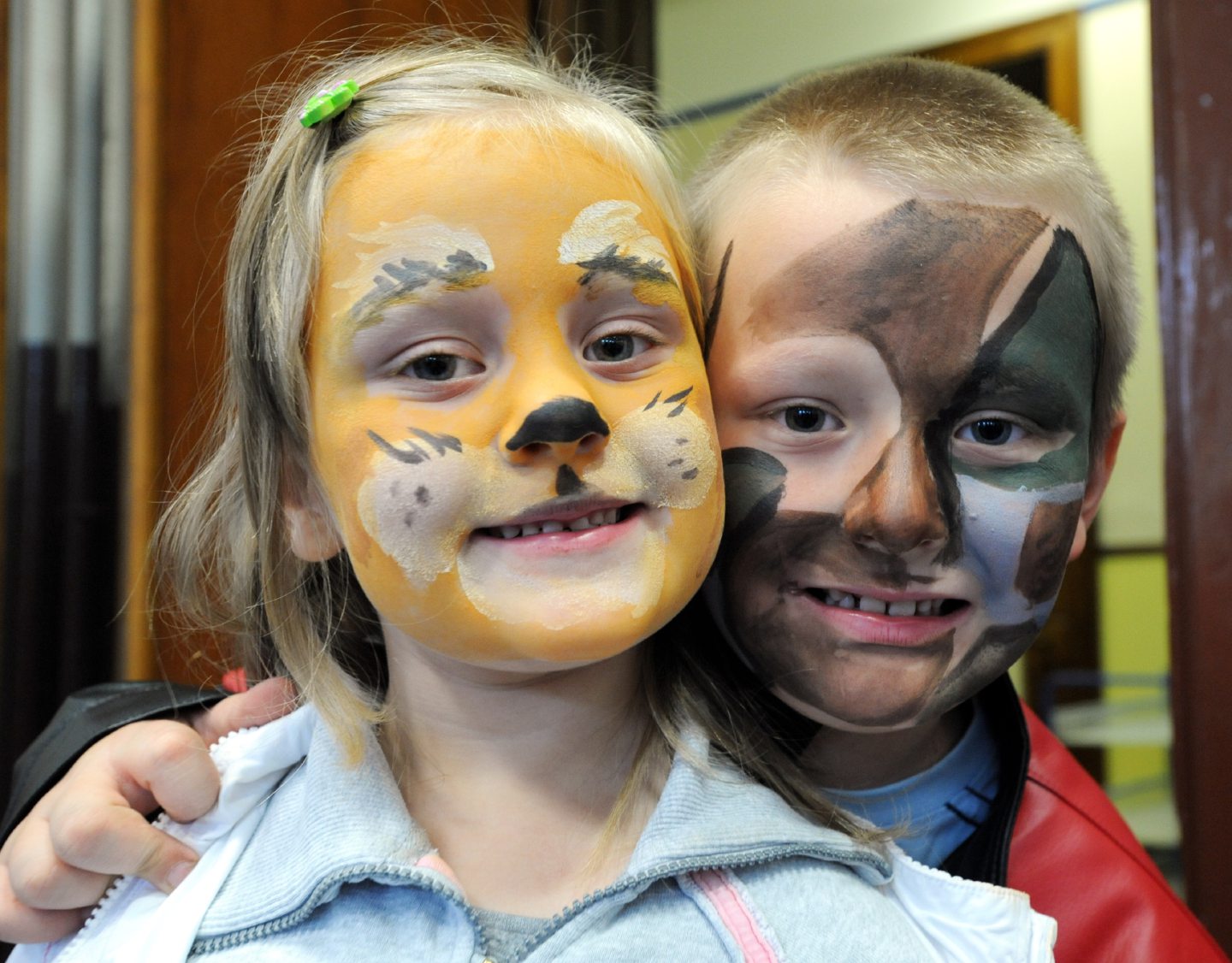Pupils Sandra Lotarewicz, 5, and her brother Rafal, 7, show off their face paint during an open day after the Walker Road merged with Victoria Road School in 2008.