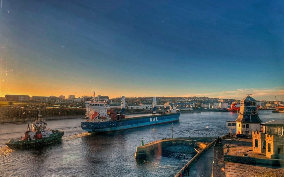 A ship being piloted into Aberdeen.