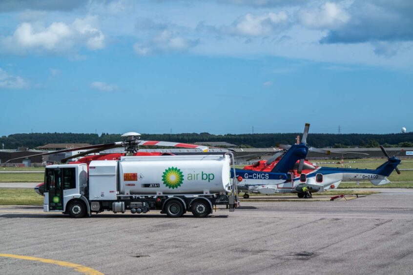 A Bristow helicopter receives fuel from a BP tanker at Aberdeen International Airport. 