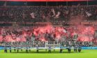 Eintracht Frankfurt's fans at Deutsche Bank Park ahead of a Champions League game against Olympiacos. Image: Shutterstock.