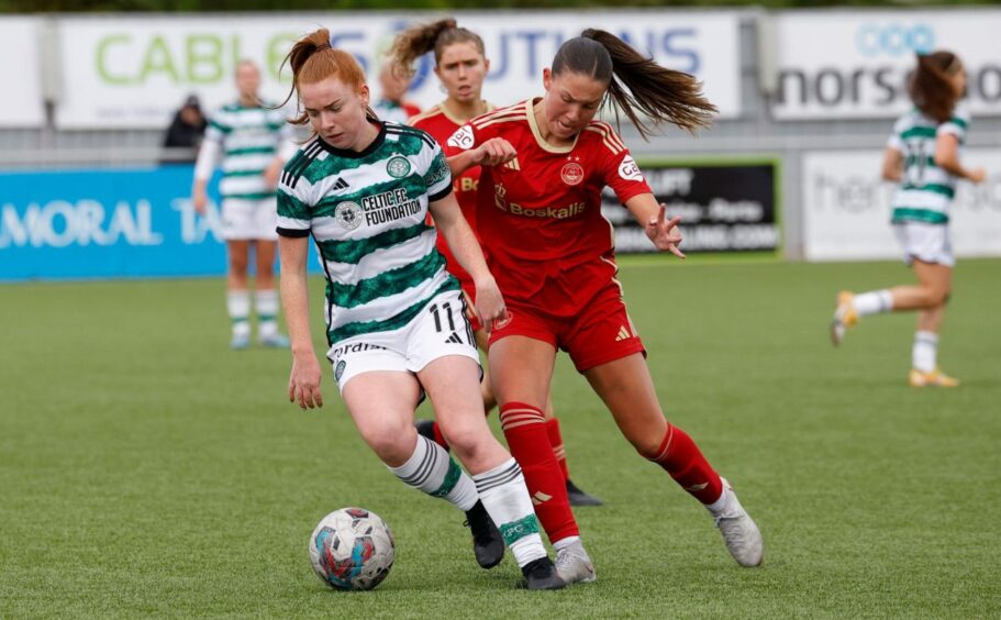 Aberdeen midfielder Phoebe Murray battles with Celtic's Colette Cavanagh in a SWPL match at Balmoral Stadium.