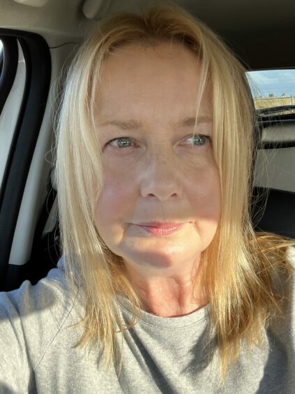 A selfie of a Donna Maclean, who says visiting her father at Dalmore cemetery has become a struggle due to tourists parking and camping in the car park.