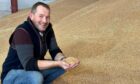 Arable manager Sandy Norrie with the winning crop of Tapestry winter wheat.