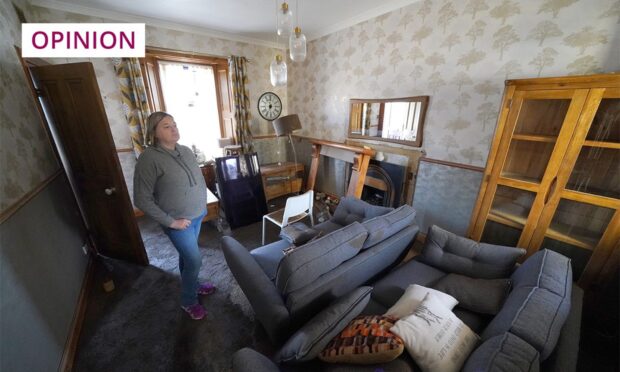 Kim Clark stands inside her flood-damaged living room in Brechin (Image: Andrew Milligan/PA Wire)